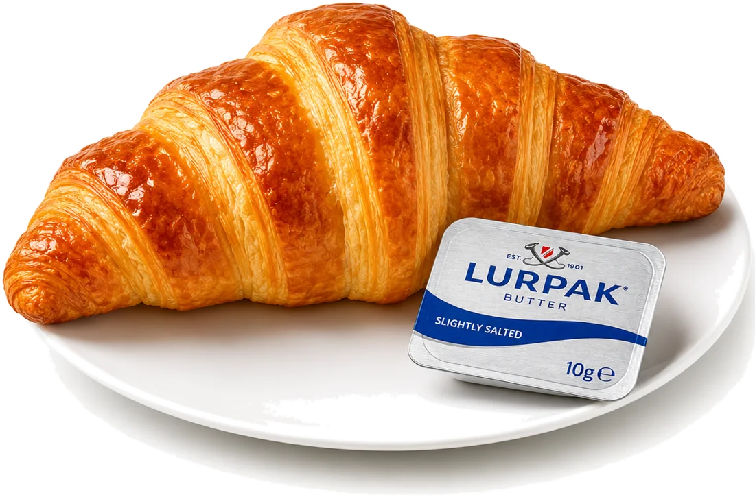 A butter croissant on a plate